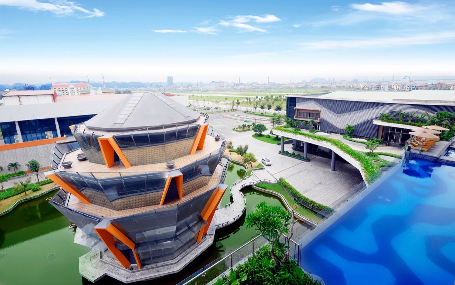 The Reed Hotel Ninh Binh — glass pavilion and infinity pool